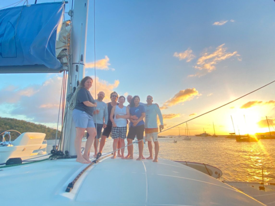 Luxury catamaran anchored in the Bahamas and the British Virgin Islands at golden hour